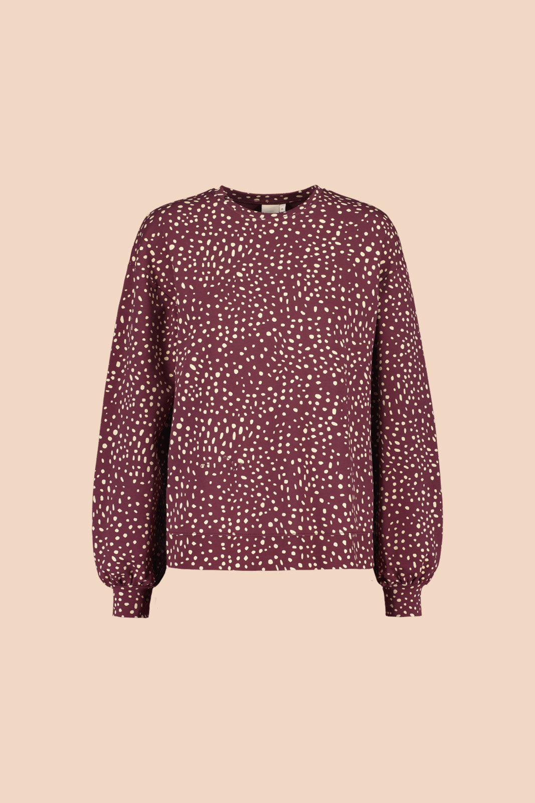 Naisten pilkullinen puuvillainen college tummanpunaisella taustalla